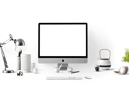Person adjusting the monitor height on a neat home office desk